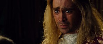 Movie still from “Alexander” (2004), directed by Oliver Stone – A person with long blonde hair; Close Up shot, Over the shoulder angle