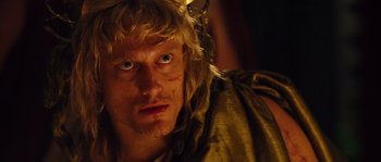 Movie still from “Alexander” (2004), directed by Oliver Stone – A person wearing a costume; Close Up shot, Over the shoulder angle