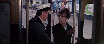 Movie still from “Alfie” (1966), directed by Lewis Gilbert – A man and a woman on a city bus; Medium shot, Low angle
