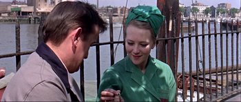 Movie still from “Alfie” (1966), directed by Lewis Gilbert – A man and a woman wearing green clothing; Close Up shot, Over the shoulder angle