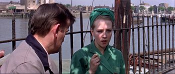 Movie still from “Alfie” (1966), directed by Lewis Gilbert – A man and a woman wearing green clothing; Close Up shot, Over the shoulder angle