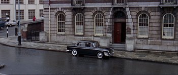 Movie still from “Alfie” (1966), directed by Lewis Gilbert – An old car parked on the side of the street; Extreme Wide shot, High angle