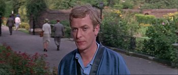 Movie still from “Alfie” (1966), directed by Lewis Gilbert – A person wearing a blue shirt; Close Up shot, Over the shoulder angle