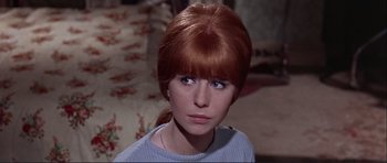 Movie still from “Alfie” (1966), directed by Lewis Gilbert – A person with red hair and blue eyes; Close Up shot, High angle