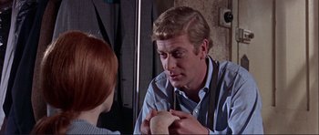 Movie still from “Alfie” (1966), directed by Lewis Gilbert – A man talking to a woman in front of a mirror; Close Up shot, Over the shoulder angle
