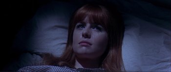 Movie still from “Alfie” (1966), directed by Lewis Gilbert – A person with long red hair; Close Up shot, Low angle