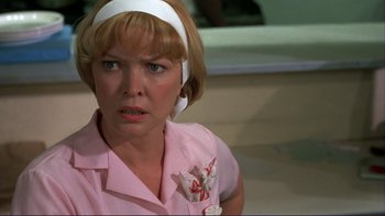 Movie still from “Alice Doesn't Live Here Anymore” (1974), directed by Martin Scorsese – A person wearing a pink shirt; Close Up shot, Low angle