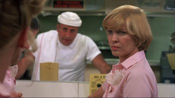 Movie still from “Alice Doesn't Live Here Anymore” (1974), directed by Martin Scorsese – A man and a woman in a kitchen; Close Up shot, Over the shoulder angle