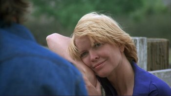 Movie still from “Alice Doesn't Live Here Anymore” (1974), directed by Martin Scorsese – A woman sitting on top of a tree with her head resting on her hand; Close Up shot, Over the shoulder angle