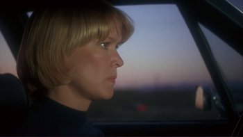 Movie still from “Alice Doesn't Live Here Anymore” (1974), directed by Martin Scorsese – A person in a car looking out the window; Close Up shot, Over the shoulder angle