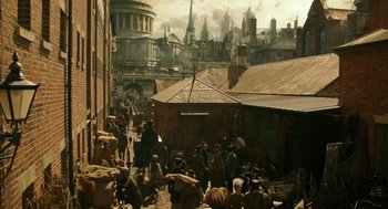 Movie still from “Alice Through the Looking Glass” (2016), directed by James Bobin – An image of an old city with people walking around it; Extreme Wide shot, High angle