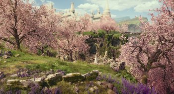 Movie still from “Alice Through the Looking Glass” (2016), directed by James Bobin – A view of some trees and a building in the background; Extreme Wide shot, High angle
