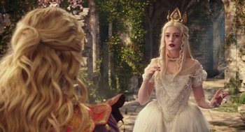 Movie still from “Alice Through the Looking Glass” (2016), directed by James Bobin – A woman in a white dress with a crown on her head; Medium shot, Over the shoulder angle