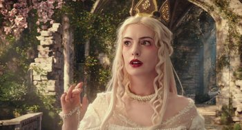 Movie still from “Alice Through the Looking Glass” (2016), directed by James Bobin – A woman with long blonde hair wearing a crown; Close Up shot, Low angle