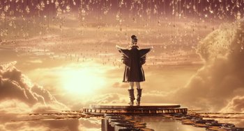 Movie still from “Alice Through the Looking Glass” (2016), directed by James Bobin – A woman standing on a platform in the middle of the ocean; Extreme Wide shot, High angle