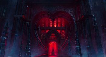 Movie still from “Alice Through the Looking Glass” (2016), directed by James Bobin – A large heart shaped room with a red light; Extreme Wide shot, Low angle