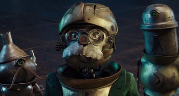 Movie still from “Alice Through the Looking Glass” (2016), directed by James Bobin – An image of a man with a beard wearing a helmet; Close Up shot, High angle