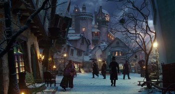 Movie still from “Alice Through the Looking Glass” (2016), directed by James Bobin – A group of people standing in front of a building; Extreme Wide shot, High angle