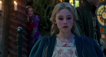 Movie still from “Alice Through the Looking Glass” (2016), directed by James Bobin – A young girl with long blonde hair and blue eyes; Close Up shot, Over the shoulder angle