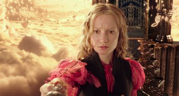 Movie still from “Alice Through the Looking Glass” (2016), directed by James Bobin – A young woman holding a gun in her hand; Close Up shot, Low angle