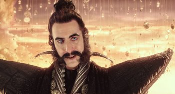 Movie still from “Alice Through the Looking Glass” (2016), directed by James Bobin – A person with long hair and a beard; Close Up shot, Low angle