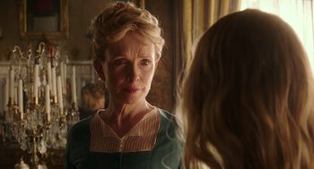 Movie still from “Alice Through the Looking Glass” (2016), directed by James Bobin – An older woman looking at a younger woman in front of a mirror; Close Up shot, Over the shoulder angle