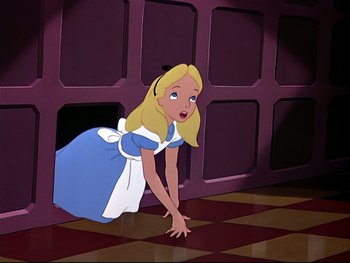 Movie still from “Alice in Wonderland” (1951), directed by Wilfred Jackson – A cartoon of a woman in a blue dress; Medium shot, High angle
