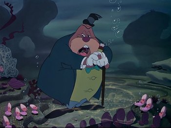 Movie still from “Alice in Wonderland” (1951), directed by Wilfred Jackson – An animated picture of a man in a blue coat and a hat; Medium shot, High angle