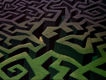 Movie still from “Alice in Wonderland” (1951), directed by Wilfred Jackson – An aerial view of a maze with a person in the middle of it; Extreme Wide shot, Overhead angle