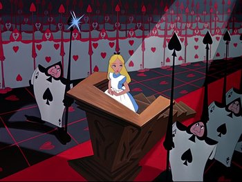 Movie still from “Alice in Wonderland” (1951), directed by Wilfred Jackson – A painting of a girl in a white dress sitting at a podium; Wide shot, High angle
