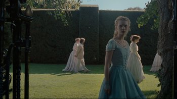 Movie still from “Alice in Wonderland” (2010), directed by Tim Burton – A group of young people dressed up as alice in wonderland; Wide shot, Low angle