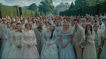 Movie still from “Alice in Wonderland” (2010), directed by Tim Burton – A group of people standing in front of each other; Wide shot, High angle