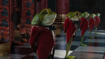 Movie still from “Alice in Wonderland” (2010), directed by Tim Burton – A couple of frogs dressed up in suits and ties; Wide shot, Low angle
