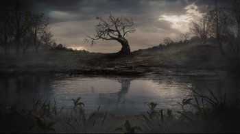Movie still from “Alice in Wonderland” (2010), directed by Tim Burton – An old tree in the middle of a field near a lake; Extreme Wide shot, High angle