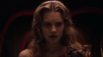 Movie still from “Alice in Wonderland” (2010), directed by Tim Burton – A person with long blonde hair; Close Up shot, Low angle