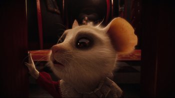 Movie still from “Alice in Wonderland” (2010), directed by Tim Burton – A stuffed animal mouse with a sweater around it's neck; Close Up shot, Over the shoulder angle