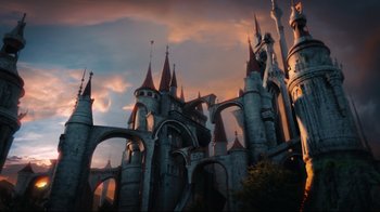Movie still from “Alice in Wonderland” (2010), directed by Tim Burton – A large castle with a sky background at sunset; Extreme Wide shot, Low angle