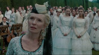Movie still from “Alice in Wonderland” (2010), directed by Tim Burton – A group of people standing in a field; Close Up shot, Over the shoulder angle