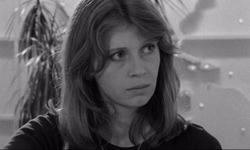 Movie still from “Alice in the Cities” (1974), directed by Wim Wenders – Black and white photograph of a woman with long hair; Close Up shot, Over the shoulder angle