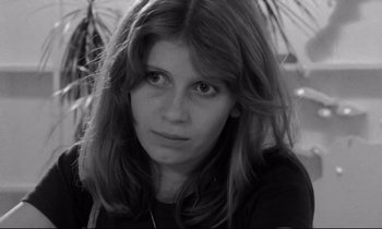 Movie still from “Alice in the Cities” (1974), directed by Wim Wenders – A black and white photo of a woman with long brown hair; Close Up shot, High angle