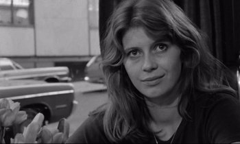 Movie still from “Alice in the Cities” (1974), directed by Wim Wenders – Black and white photograph of a woman with long hair; Close Up shot, Over the shoulder angle