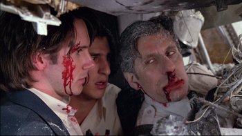 Movie still from “Alive” (1993), directed by Frank Marshall – A group of men with fake blood on their faces; Close Up shot, Low angle