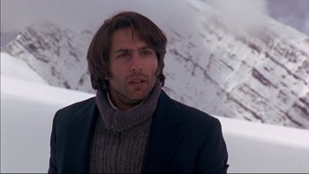 Movie still from “Alive” (1993), directed by Frank Marshall – A person wearing a jacket and a sweater; Close Up shot, Low angle