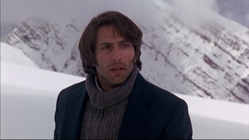 Movie still from “Alive” (1993), directed by Frank Marshall – A person wearing a jacket and a sweater; Close Up shot, Low angle