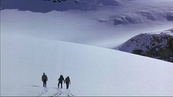 Movie still from “Alive” (1993), directed by Frank Marshall – A group of skiers on a snowy slope; Extreme Wide shot, High angle
