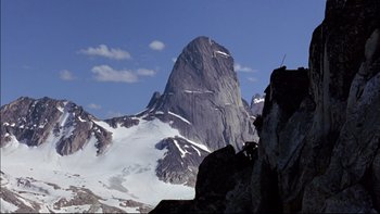 Movie still from “Alive” (1993), directed by Frank Marshall – A large mountain with snow on it's side; Extreme Wide shot, Low angle