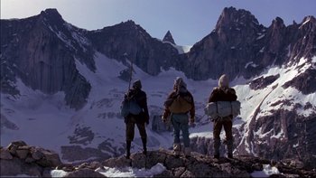 Movie still from “Alive” (1993), directed by Frank Marshall – A group of people standing on top of a snow covered slope; Wide shot, Low angle
