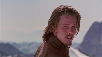 Movie still from “Alive” (1993), directed by Frank Marshall – A person with long hair; Close Up shot, Low angle