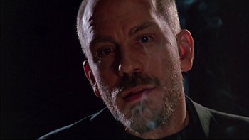 Movie still from “Alive” (1993), directed by Frank Marshall – A person with a beard; Close Up shot, Low angle