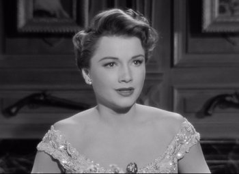 Movie still from “All About Eve” (1950), directed by Joseph L. Mankiewicz – A black - and - white photo of a woman in a dress; Close Up shot, High angle